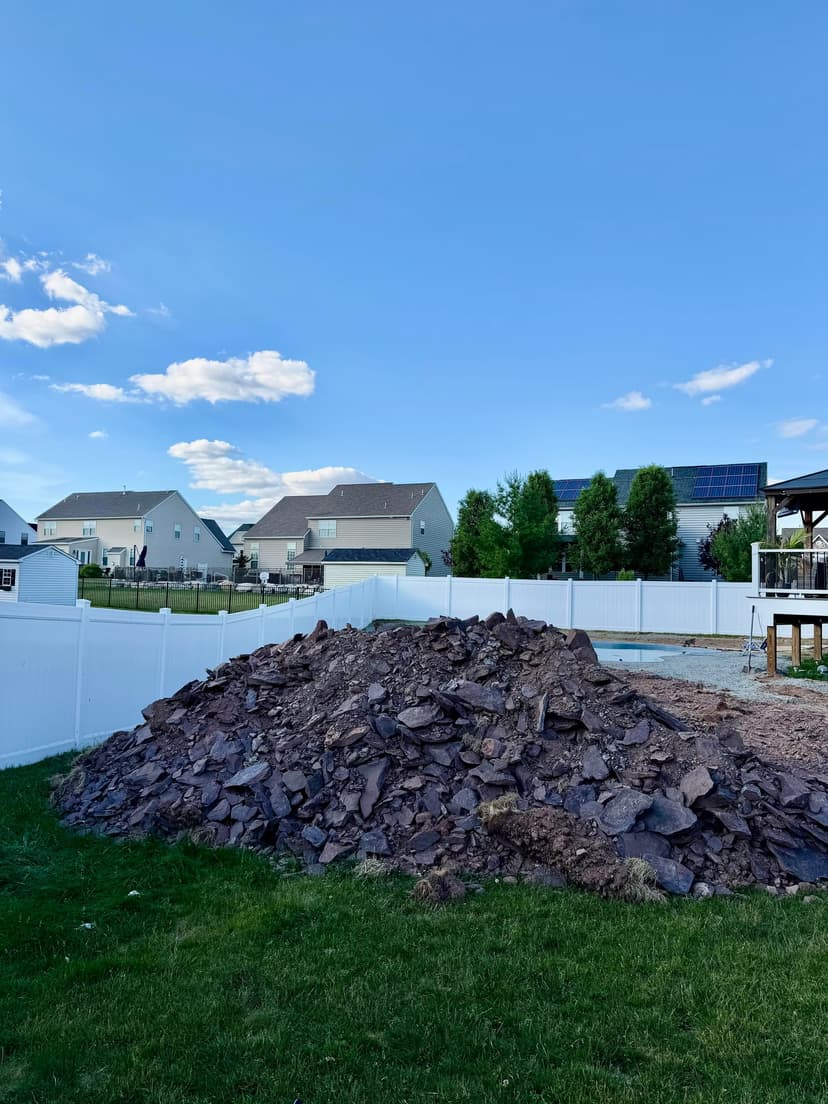 remove dirt, grade yard, and seed